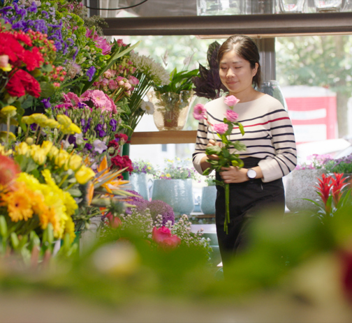 Woman Working In A Florist Store