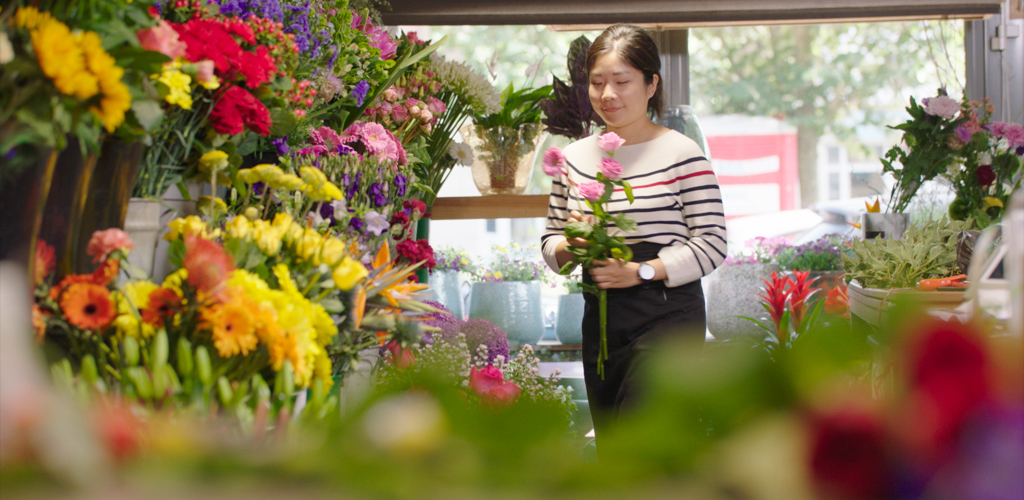 Woman Working In A Florist Store